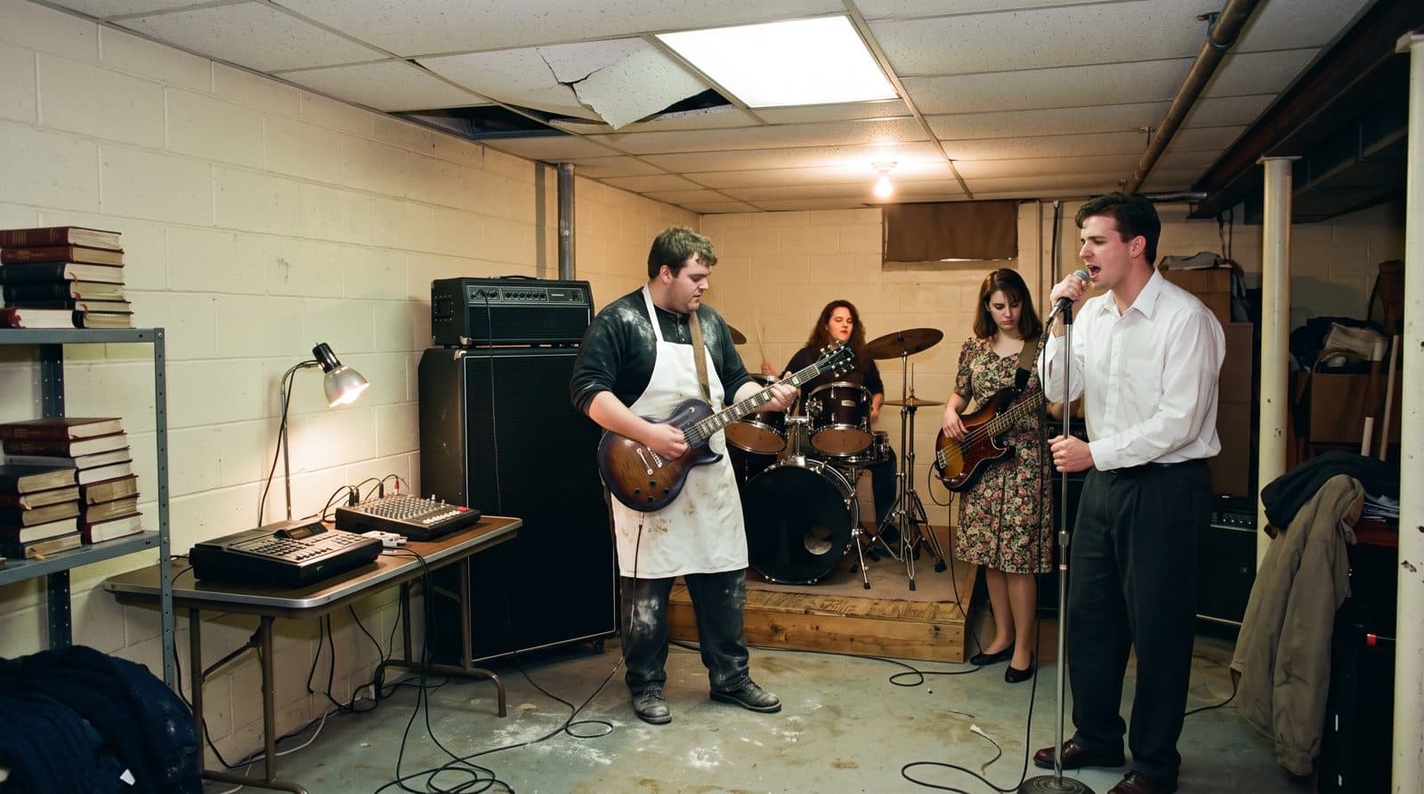 A band recording in a church basement with a four-track machine