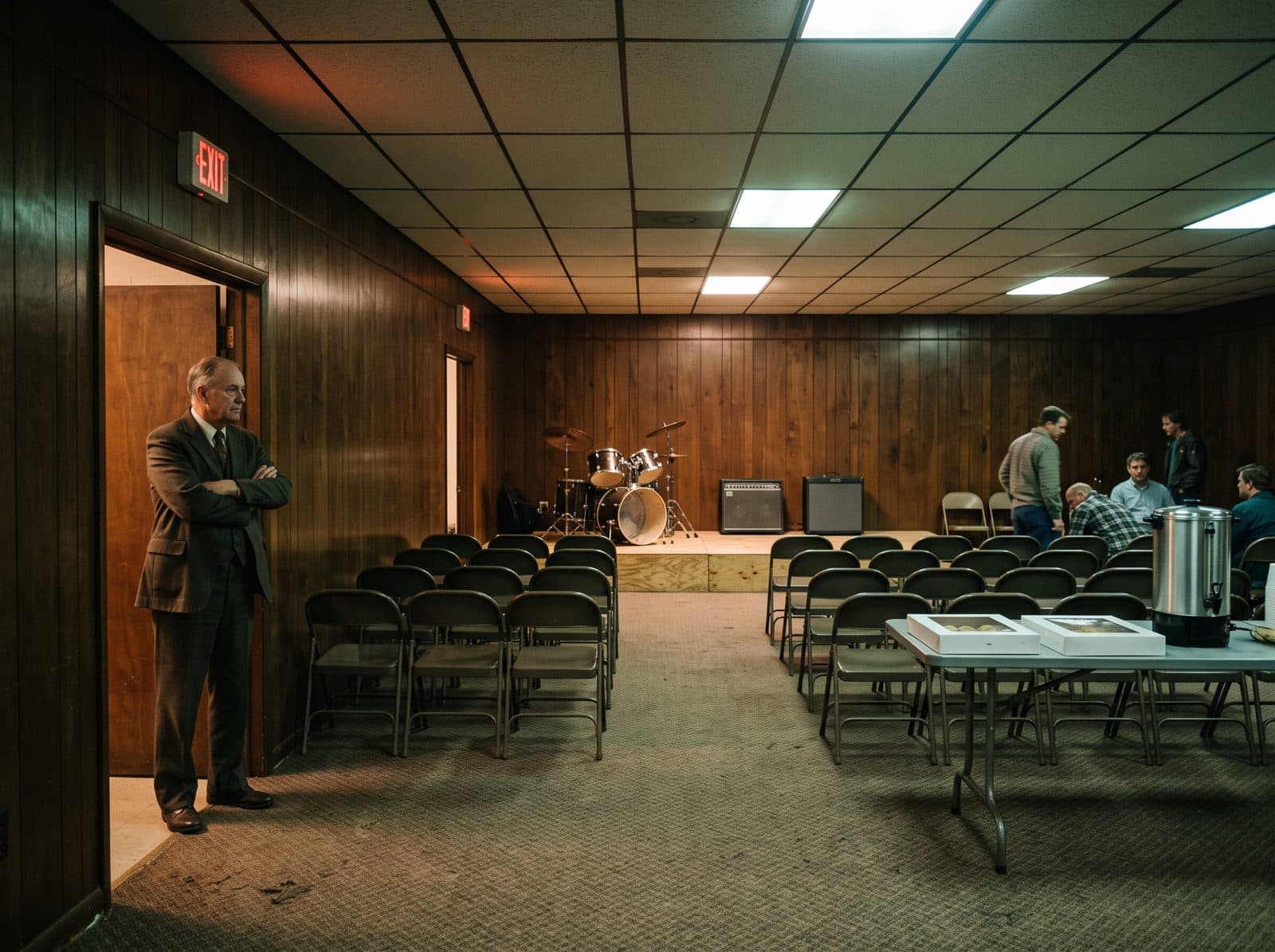 A church fellowship hall set with folding chairs before an evening show